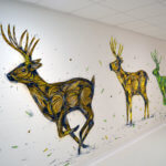 Fresque de trois cerfs qui court